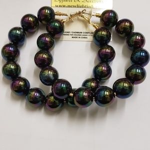 Earrings by: New light ink Apparel and Accessories